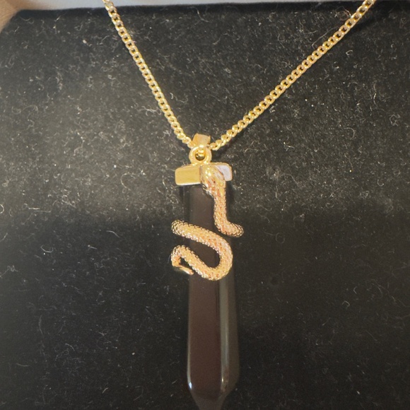 Gold tone snake pendant necklace on black onyx point.   Aldo tag on chain. - Picture 1 of 5